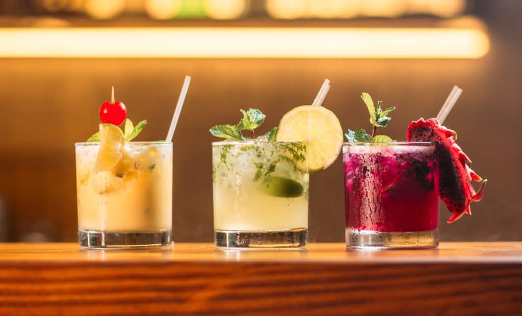 3 colorful cocktails on a table