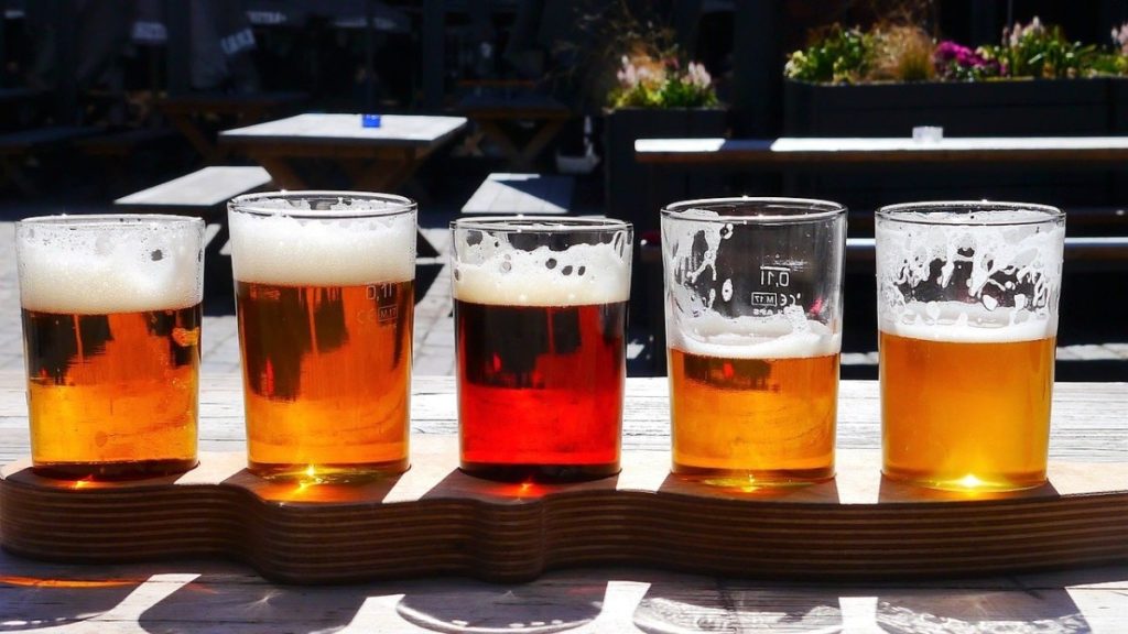 Flight of beers on wooden rack