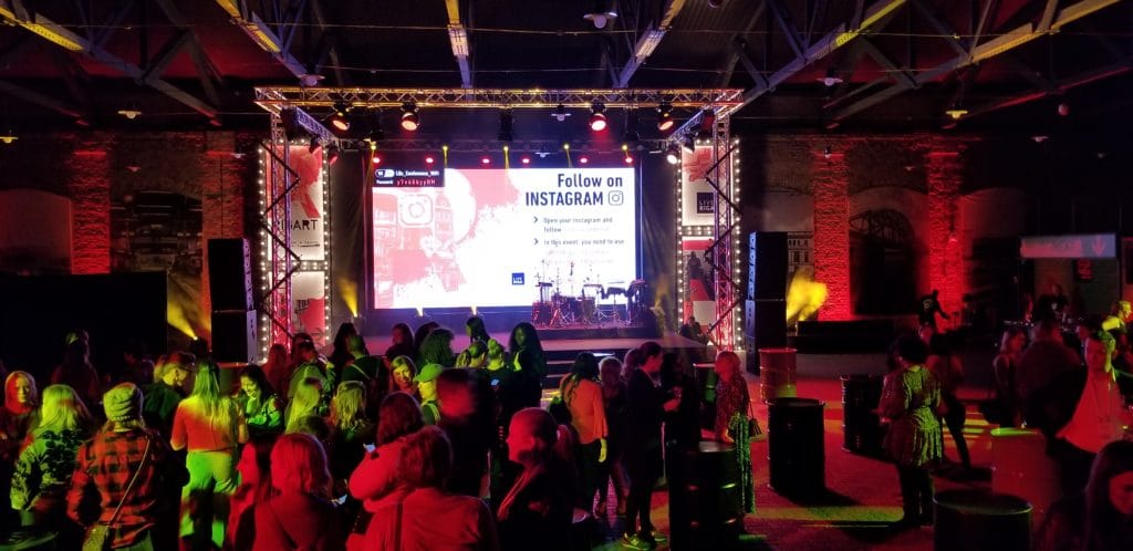 Crowd in front of the stage at Women in Travel Summit in Riga, Latvia