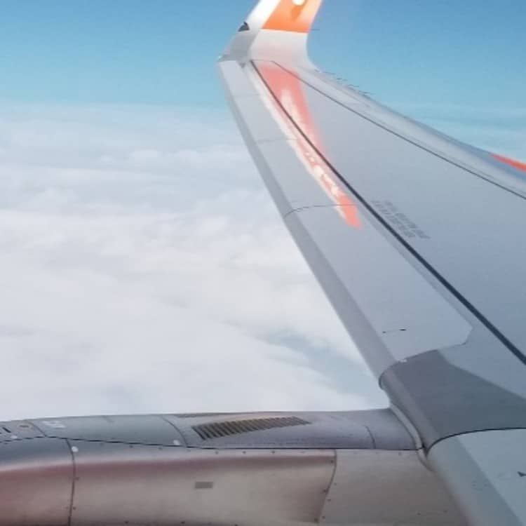Image of airplane wing from airplane window