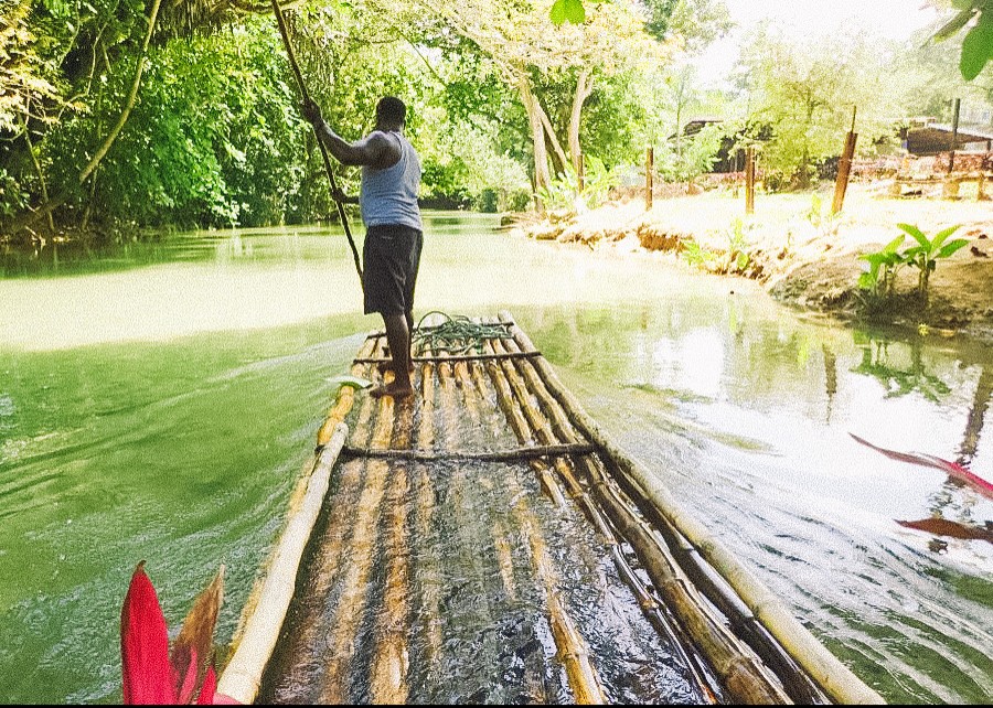 Man on wooden raft in Jamaica