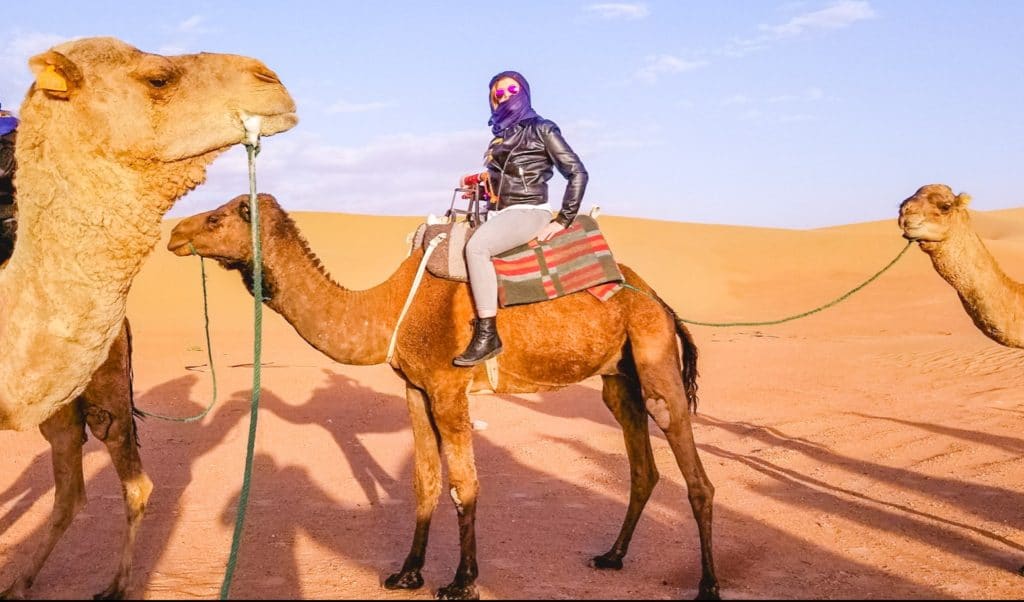 Eden Fite on a camel in the Sahara desert, Morocco