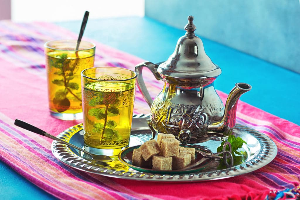 Tray of Moroccan mint tea on a blue table