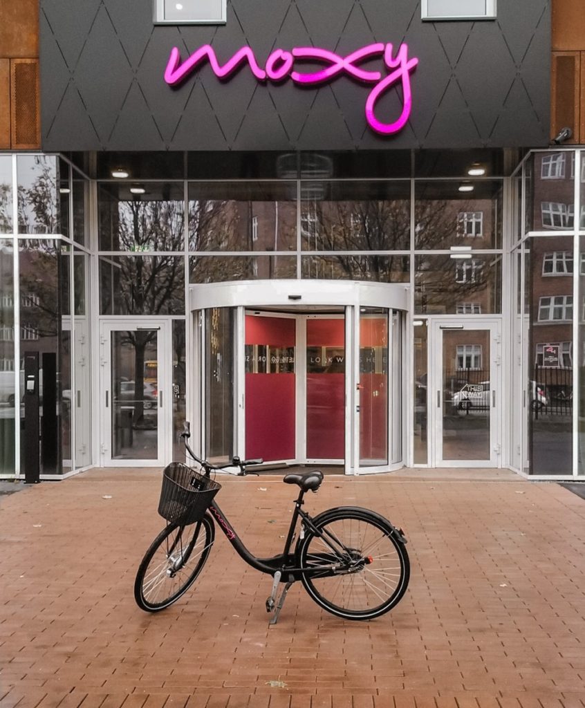 Black bicycle in front of the Moxy Hotel in Copenhagen, Denmark