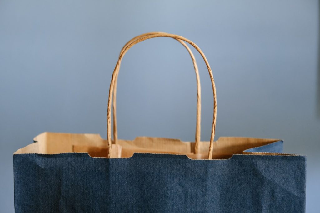 Top of a blue paper shopping bag